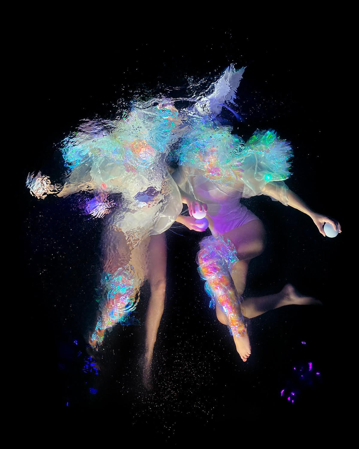 Swirling Fabrics Envelop Floating Subjects in Underwater Photographs by Christy Lee Rogers