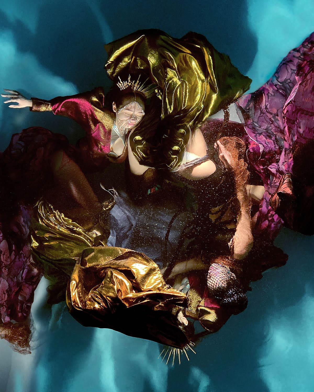 Swirling Fabrics Envelop Floating Subjects in Underwater Photographs by Christy Lee Rogers
