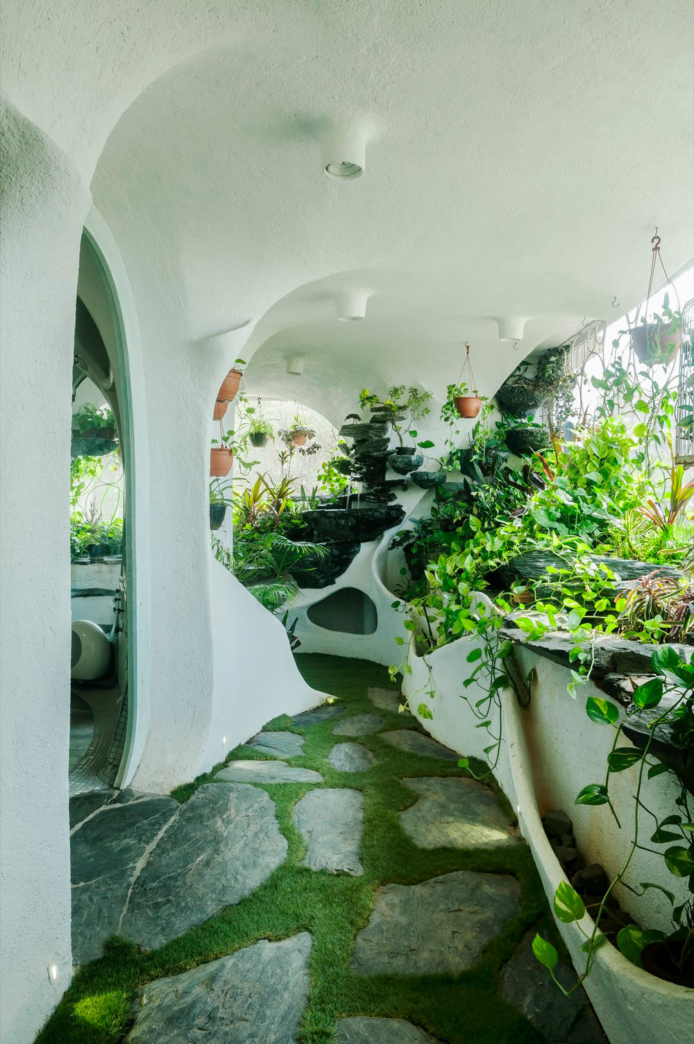 A Verdant Landscape Breathes Life into a One-Bedroom Apartment in a Suburb of Mumbai