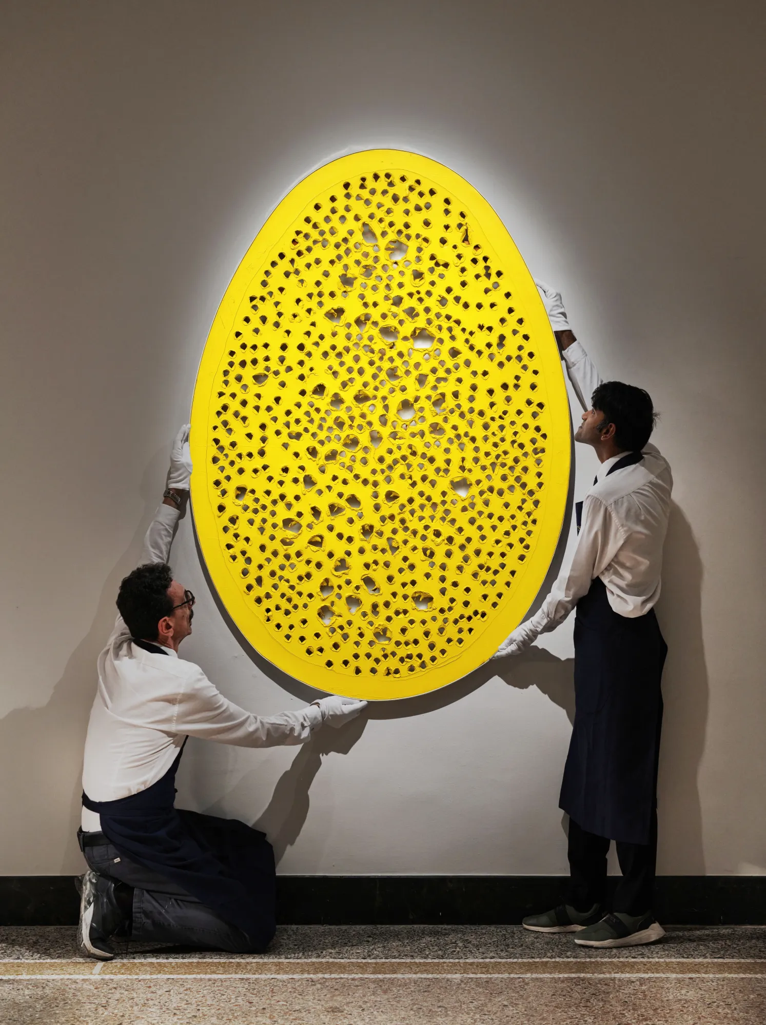An egg-shaped canvas cover in holes.