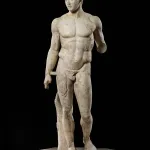 A marble stature of a very muscular man.