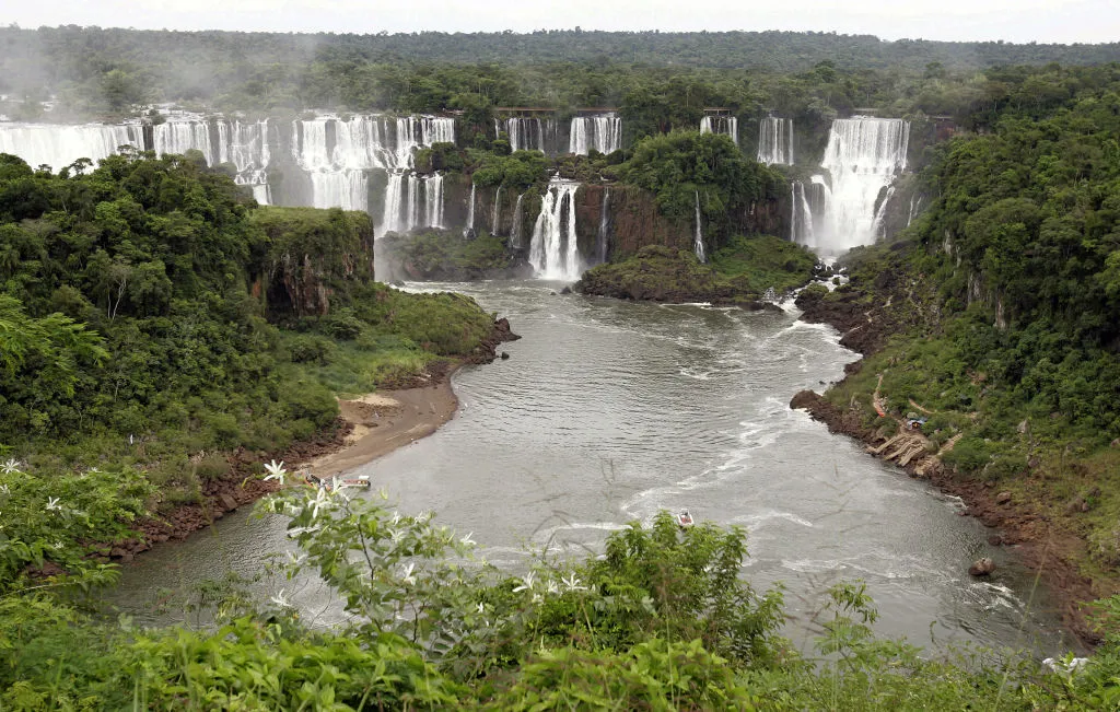 Partial view of the Argentine side of Iguazu Falls and San Martin island from the Brazilian side of the Iguazu River near the Brazilian city of Foz do Iguazu, 17 January 2007. AFP PHOTO/Juan MABROMATA (Photo by Juan MABROMATA / AFP) (Photo by JUAN MABROMATA/AFP via Getty Images)