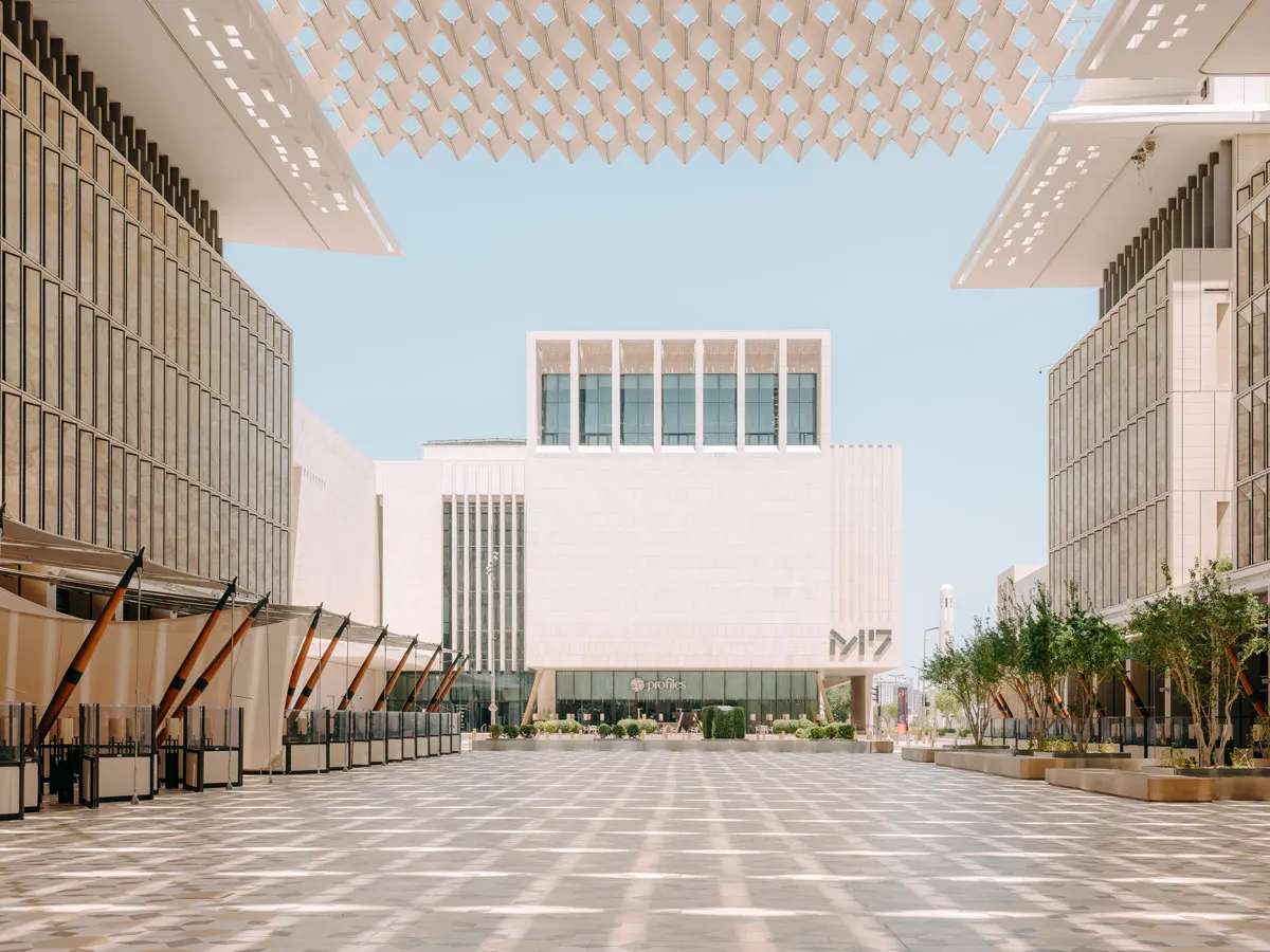 View of a white building, seen across a courtyard, that reads M7.