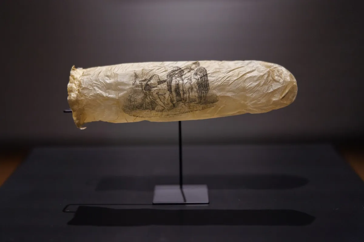 An image of a condom in a museum.