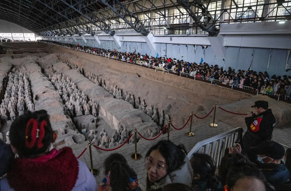 Tourists gather to see terra-cotta warriors at the Museum of Qin Terracotta Warriors and Horses in Xi