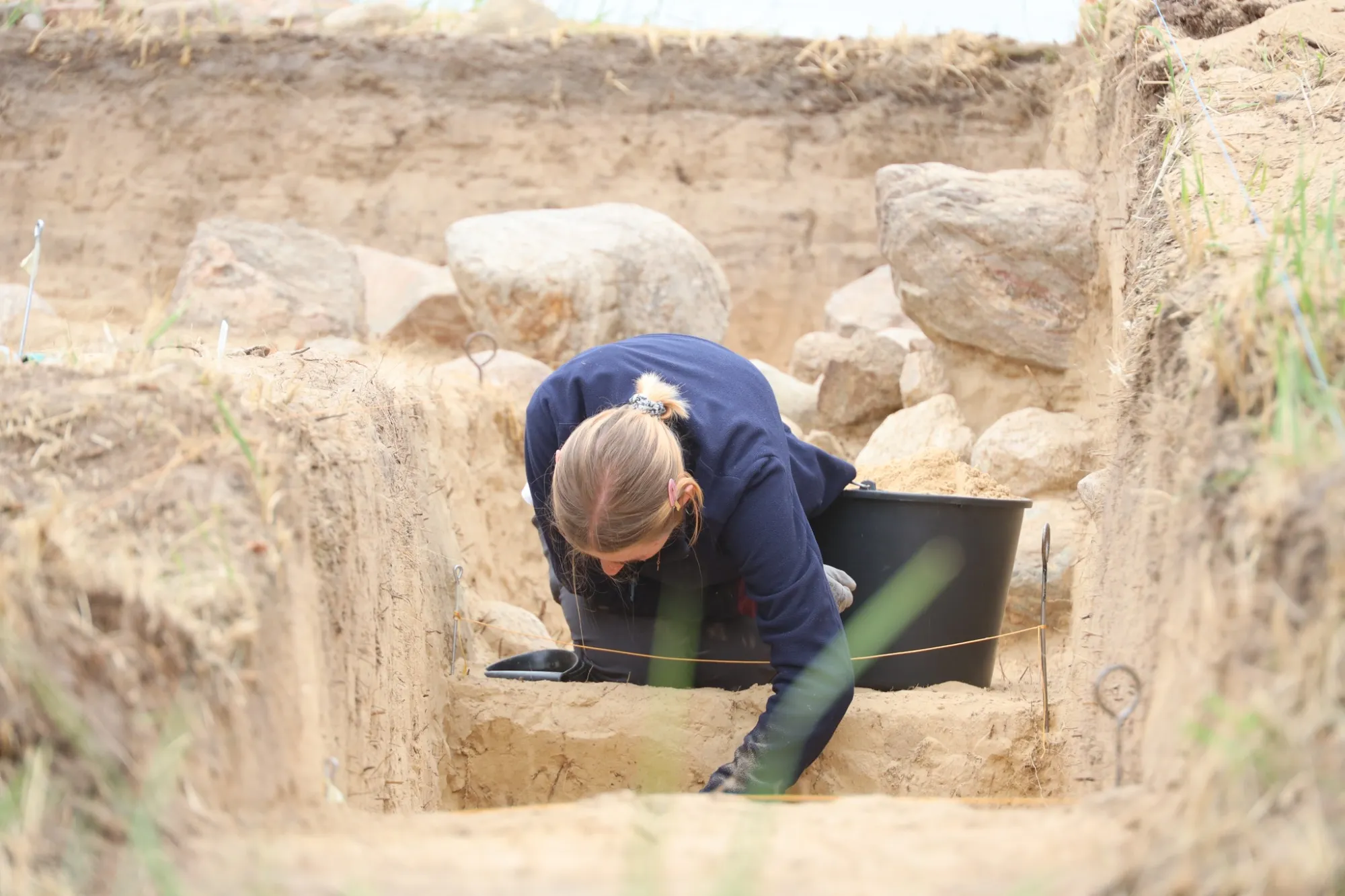 An archaeologist excavating the tomb