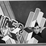 British pop artist Peter Phillips seen through a star-shaped hole in a version of his painting INsuperSET, ca. 1963.