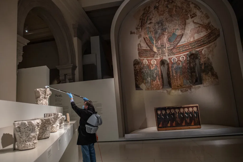 BARCELONA, SPAIN - JUNE 08: A restorer vacuums Romanesque art master pieces at the Catalonia National Art Museum (MNAC) on June 08, 2020 in Barcelona, Spain. The MNAC will open on June 10 with its capacity reduced to 30%. Spain has largely ended the lockdown it imposed to curb the spread of Covid-19, which caused the death of more than 27,000 people across the country. This week all regions are on Phase One or Two, one month after all of Spain started on Phase Zero on May 4, 2020. (Photo by David Ramos/Getty Images)