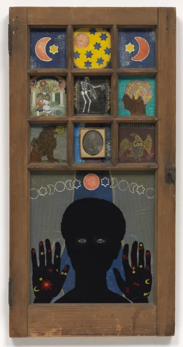A sculpture resembling a window onto which is painted an image of a Black girl holding up her hands. Onto other panes are painted images of stars, moons, and heads.