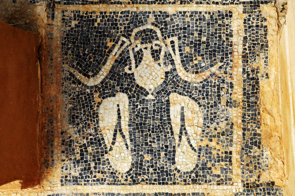 A Roman mosaic in the archaeological site of Sabratha, picturing ancient sandals