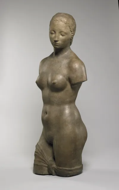 A sculpture of a nude woman.