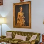 A painting hanging above a couch.