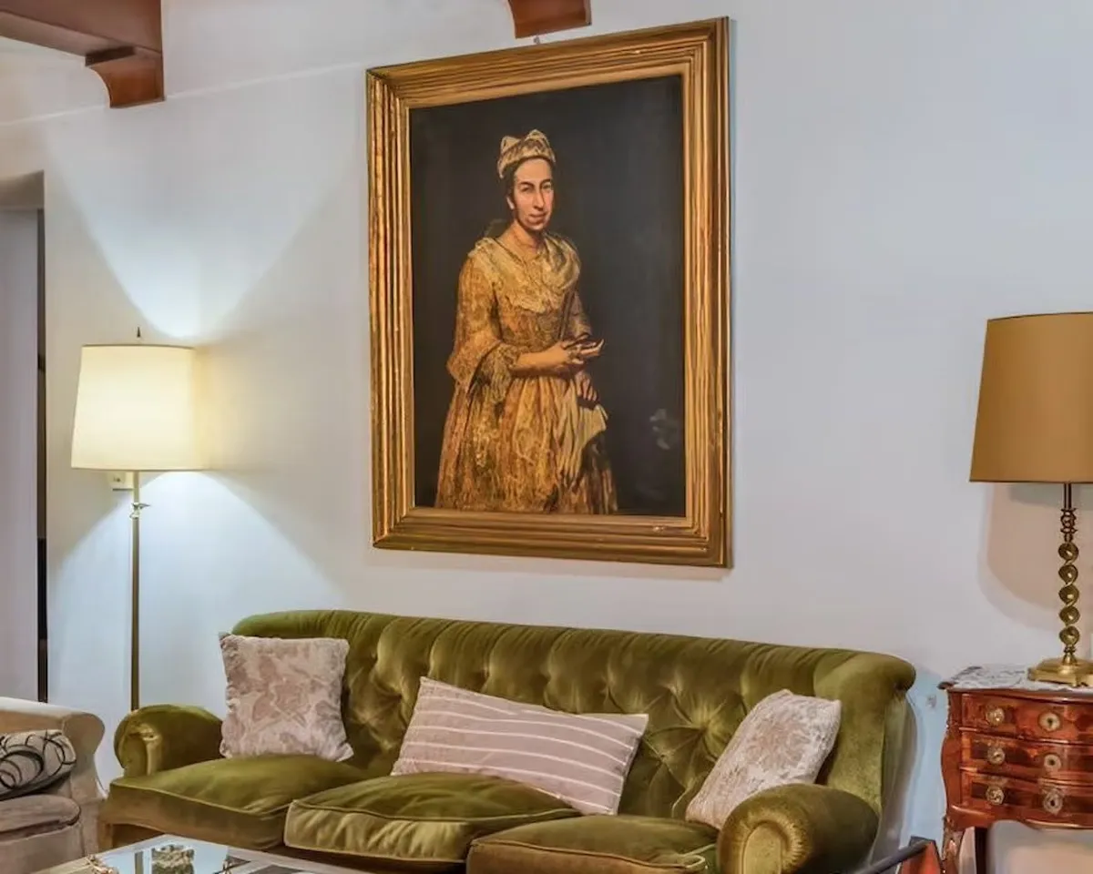 A painting hanging above a couch.