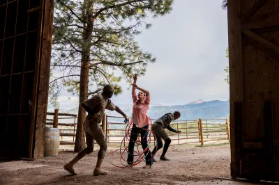 Three performers on a ranch in Aspen. 