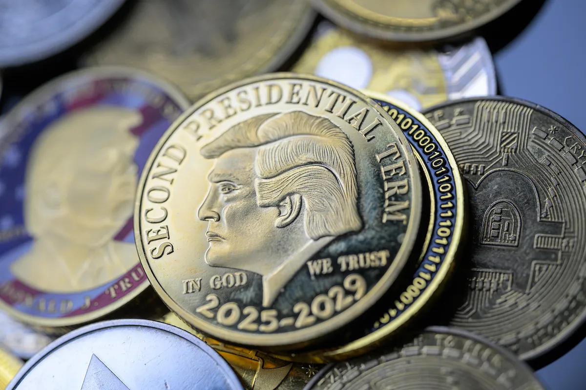 A gold. coin with Trump