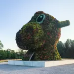 POTOMAC, MD - JULY 10, 2017: Jeff Koonss sculpture Split-Rocker at Glenstone is composed of tens of thousands of flowering plants. This side is the dinosaur side, which is made up of magenta, orange, and yellow flowers. (Photo by Jennifer Heffner for The Washington Post via Getty Images)