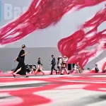 Visitors walk past Katharina Grosse
