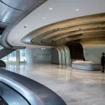 Staff are seen at the reception of The Henderson, a new skyscraper designed by Zaha Hadid Architects, where Christie