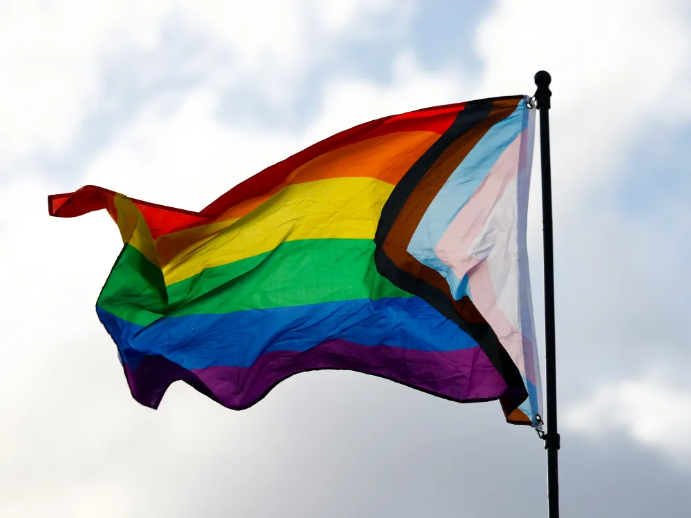 A flag with the colours of the rainbow.