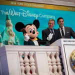 NEW YORK, NY - NOVEMBER 27: (L to R) Mickey Mouse and chief executive officer and chairman of The Walt Disney Company Bob Iger prepare to ring the opening bell at the New York Stock Exchange (NYSE), November 27, 2017 in New York City. Disney is marking the company