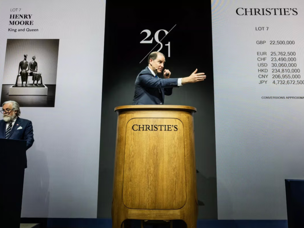 A man behind a rostrum.