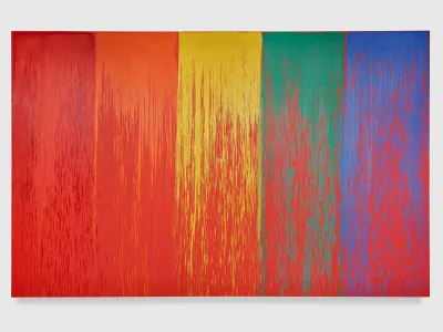 An abstract painting of rainbow colors over a red-orange ground.