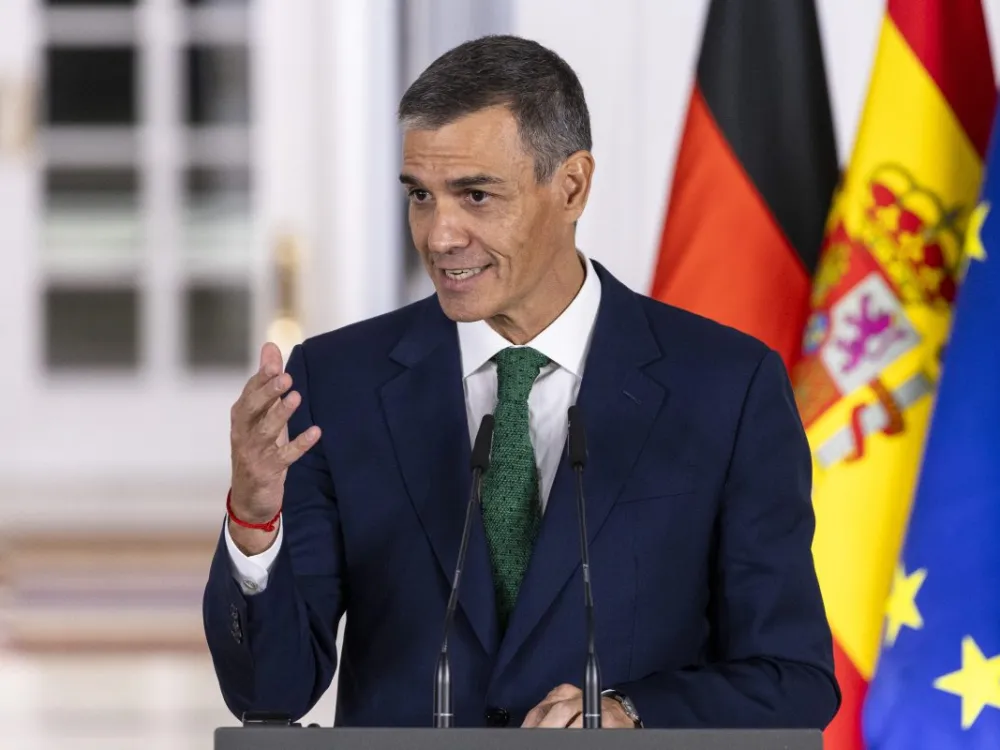 MADRID, SPAIN - SEPTEMBER 18: Spanish Prime Minister Pedro Sanchez speaks next to German Chancellor Friedrich Merz during a press conference following a meeting at Moncloa Palace on September 18, 2025 in Madrid, Spain. The leaders were expected to discuss security policy and other European political issues. (Photo by Pablo Blazquez Dominguez/Getty Images)