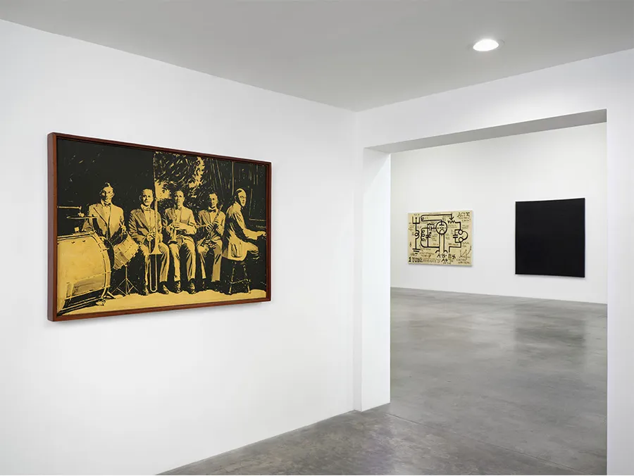 A gallery with photographs on its walls.