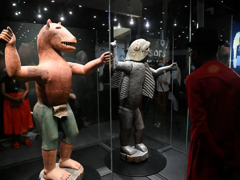 Two sculptures in a vitrine.