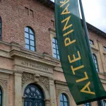 A red brick building and green banner.