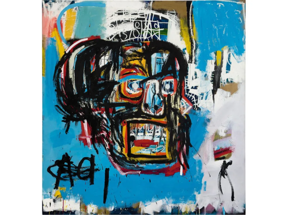 A Basquiat painting of a large skull on a blue background.