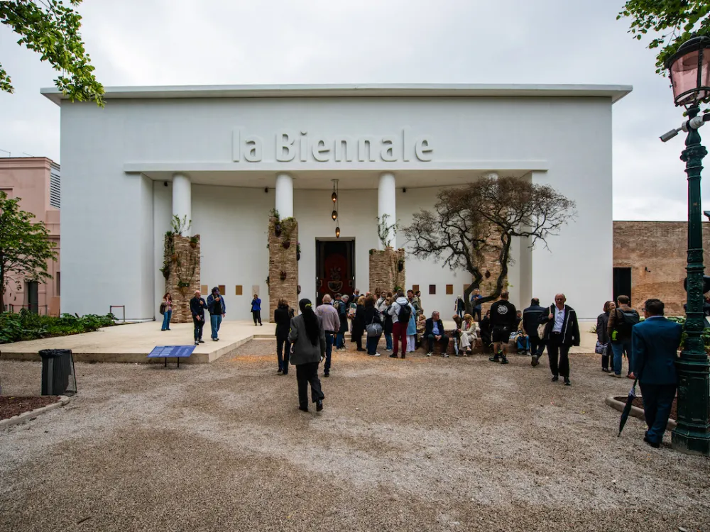 People walking toward a pavilion marked with 
