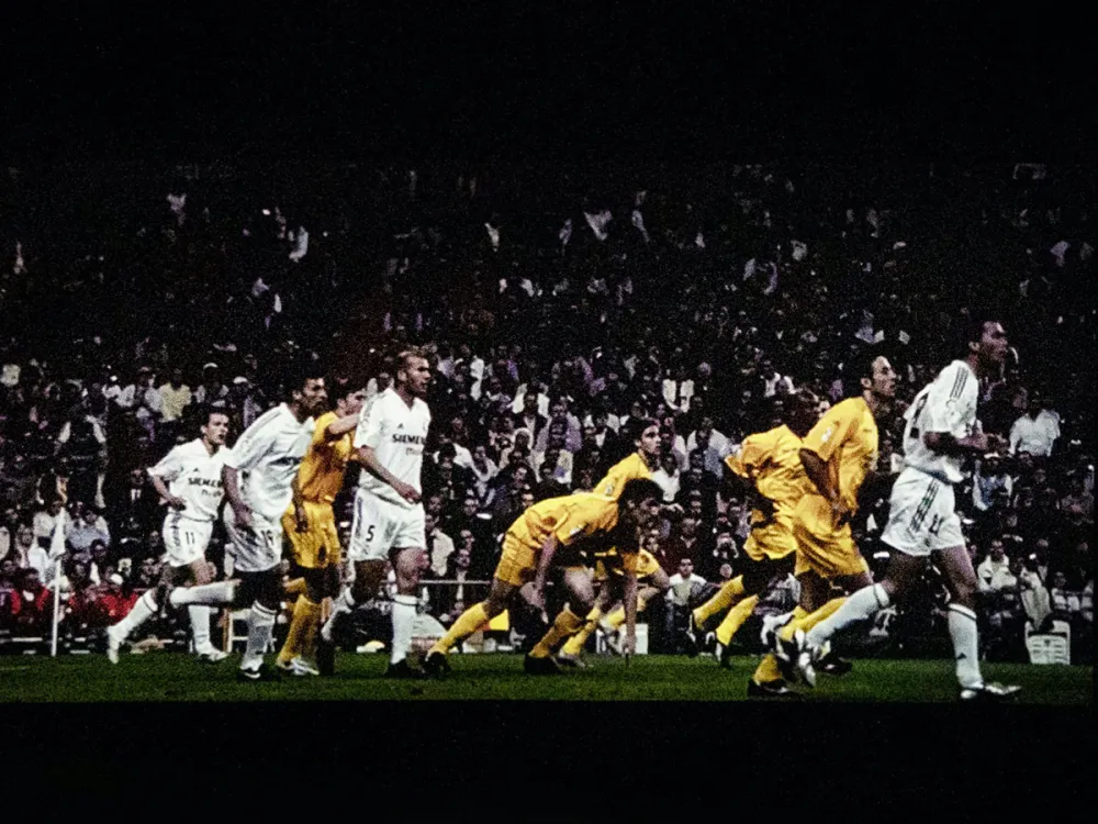 Footage of players during a football match in 2005, including Zinédine Zidane.
