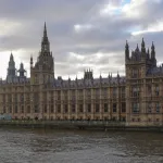 The Gothic Revival architecture of the Palace of Westminster stands along the River Thames in London, England, United Kingdom, on December 24, 2025. This historic landmark serves as the seat of the Parliament of the United Kingdom, featuring the Victoria Tower and the long river-facing facade of the House of Commons and House of Lords (Photo by Michael Nguyen/NurPhoto via Getty Images).