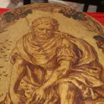 A 17th century painting featuring a man in robes crouching down.