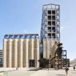 exterior of a concrete and glass museum against a blue sky