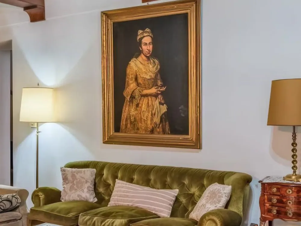 A painting hanging above a couch.