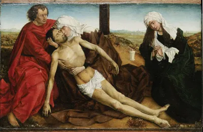 A painting of three saints holding the dead Christ, with a lit candle.