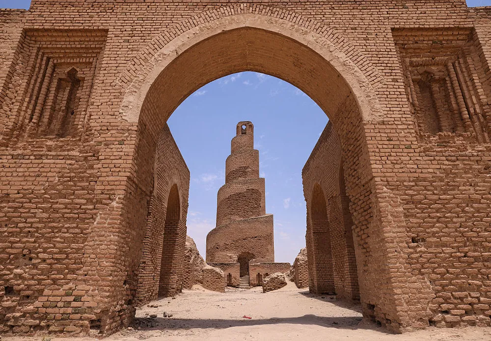 A photograph shows the spiral minaret of the ancient Abu Dulaf Mosque near the city of Samarra on June 4, 2026. The Abu Dulaf Mosque is one of the most significant Islamic and archaeological landmarks in Iraq. It was commissioned by the Abbasid caliph al-Mutawakkil and completed in 859 CE as part of the city of al-Mutawakkiliyya. The mosque forms part of the Samarra Archaeological City, which was inscribed on the UNESCO World Heritage List in 2007. (Photo by AHMAD AL-RUBAYE / AFP via Getty Images)