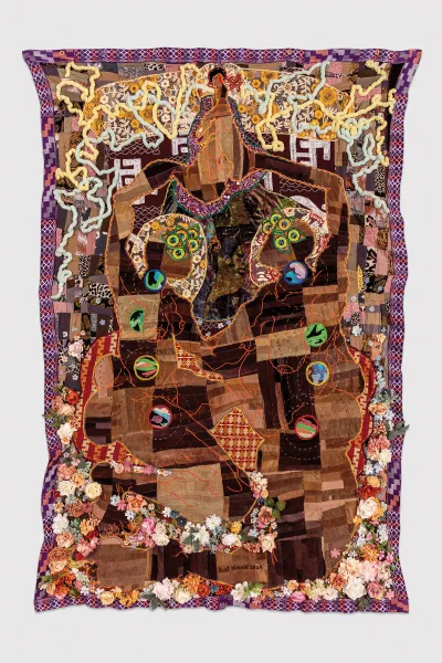 A mixed-media work of various objects affected to a tapestry.