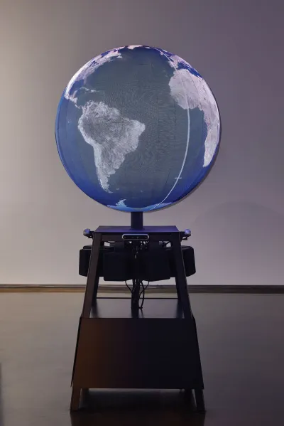 A sculpture of a globe that spins.