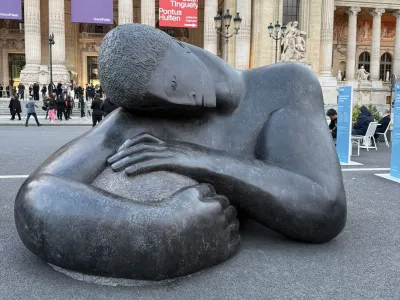 A large-scale sculpture of a man