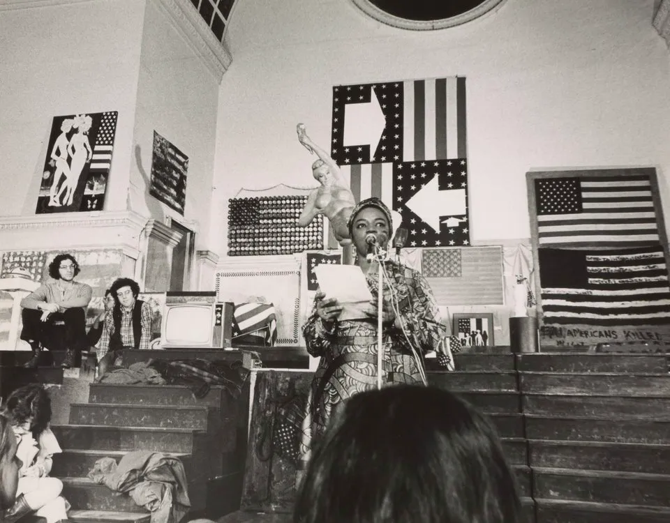 black and white photogrpah of a woman at a microphone